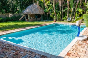 Pool in yard with hut- Miami FL