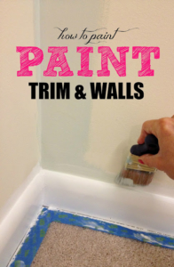Hand with a paintbrush painting a wall white