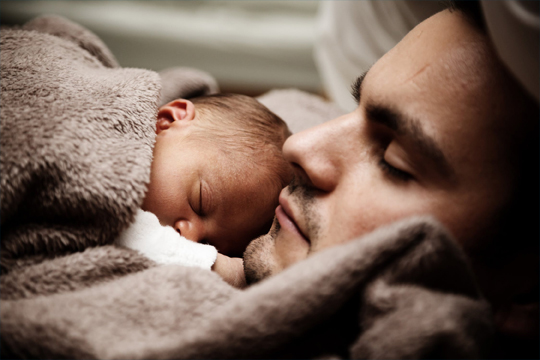 dad sleeping with baby