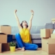 woman happy moving boxes